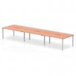 This image shows a modern dynamic bench desking setup called Evolve Plus measuring 1400mm. It is designed for 6 people and features a sleek silver frame with a warm beech top. This office bench desk provides ample space for collaboration and productivity.