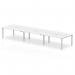 This picture features a sleek and modern office bench desk that comfortably seats six people. The white top and silver frame provide a clean and professional look. Perfect for a dynamic and collaborative work environment.