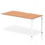 In the image, the dynamic bench desk features a sleek and modern design with a 1600mm oak top and white frame. The single row desk is perfect for any office space, providing ample room for productivity.