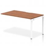 The Dynamic Bench Desking Evolve Plus is a sleek and modern office bench desk. The 1400mm desk is designed with a walnut top and white frame, giving it a professional and stylish look. The single row configuration allows for a spacious and efficient work area. Perfect for any office space.