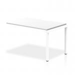 The photograph depicts a modern office space with a sleek, white bench desk stretching 1200mm in a single row. The white frame provides a clean and contemporary look, while the top offers a spacious and versatile work surface. This bench desk is the perfect addition to any dynamic office environment.