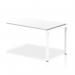 The photograph depicts a modern office space with a sleek, white bench desk stretching 1200mm in a single row. The white frame provides a clean and contemporary look, while the top offers a spacious and versatile work surface. This bench desk is the perfect addition to any dynamic office environment.