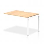 The photo shows a sleek and modern office desk, with a 1200mm single row layout. The desk features a maple wood top and a clean white frame, adding a touch of elegance to any workspace. The dynamic design of this bench desking system is perfect for maximizing productivity.