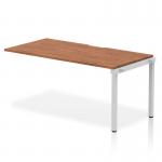 The Dynamic Bench Desking Evolve Plus is a sleek and modern 1600mm single row office bench desk with a walnut top and silver frame. Its dynamic design allows for multiple configurations to fit any workspace, while the sturdy construction ensures long-lasting durability. The walnut top adds a touch of warmth, while the sleek silver frame gives a hint of sophistication. Designed for functionality and versatility, this desk is perfect for any office space.