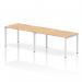 This photograph features a sleek and modern Dynamic Bench Desking Evolve Plus desk with a 1400mm single row and a 2 person capacity. The desk has a crisp maple top and a clean white frame.
