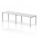 The photograph shows a sleek and modern Dynamic Bench Desking Evolve Plus desk. It is 1400mm in length and can accommodate two people in a single row. The desk has a white top and a silver frame, giving it a clean and contemporary look.