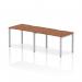 This image shows a sleek and modern 1200mm single row 2 person office bench desk with a walnut top and silver frame. The dynamic design allows for a comfortable and stylish workspace for two individuals.
