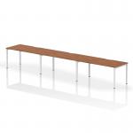 Three people can comfortably work at the walnut-topped, white-framed Dynamic Bench Desking Evolve Plus 1600mm Single Row office desk. Its sleek and modern design enhances any workspace.