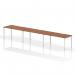Three people can comfortably work at the walnut-topped, white-framed Dynamic Bench Desking Evolve Plus 1600mm Single Row office desk. Its sleek and modern design enhances any workspace.