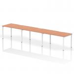 The Dynamic Bench Desking Evolve Plus 1400mm Single Row 3 Person Office Bench Desk features a sleek, beech top and white frame. Perfect for a modern office space, this desk provides ample room for three individuals to work comfortably and efficiently.