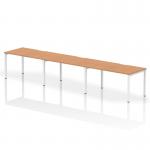 The dynamic bench desking evolve plus 1400mm single row 3 person office bench desk features an elegant oak top and a sleek white frame, exuding a modern and professional look. Its sturdy structure and practical design make it a functional addition to any office space. The spacious workspace comfortably accommodates multiple users, fostering collaboration and productivity.