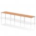 The dynamic bench desking evolve plus 1400mm single row 3 person office bench desk features an elegant oak top and a sleek white frame, exuding a modern and professional look. Its sturdy structure and practical design make it a functional addition to any office space. The spacious workspace comfortably accommodates multiple users, fostering collaboration and productivity.