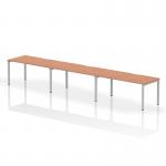 This dynamic bench desking setup features a sleek 1600mm beech top resting on a silver frame, creating a modern and professional workspace. With room for three people, it promotes collaboration and productivity.