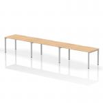 The current image shows a modern and functional single row office desk with three seating spaces. The maple top and silver frame create a sleek and professional look, while the dynamic design allows for easy collaboration and productivity.