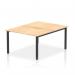 The photograph shows a sleek and modern 1200mm two-person office bench desk from the Evolve Plus collection. The desk features a beautiful maple top and a striking black frame, creating a dynamic and stylish appearance. It is a perfect option for a collaborative work environment.