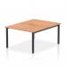 This picture showcases the stunning Dynamic Bench Desking Evolve Plus desk, specifically the 1200mm B2B 2 person option. The desk features a sleek oak top and sturdy black frame, creating a modern and stylish office space for two people.