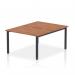 A photo of the Dynamic Bench Desking Evolve Plus 1200mm B2B 2 Person Office Bench Desk shows a sleek and modern design. The desk features a walnut top and black frame, creating a stylish contrast. Perfect for a collaborative work environment, this desk offers functionality and sophistication.
