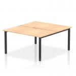 This picture features a 1400mm Dynamic Bench Desking Evolve Plus with a maple top and black frame. It is a 2 person office bench desk, providing a spacious and modern work space. The sleek design and sturdy construction make it ideal for any professional setting.