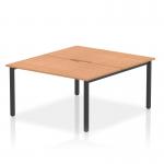 The Dynamic Bench Desking Evolve Plus 1400mm B2B 2 Person Office Bench Desk has a sleek and modern design. It features an oak top and black frame, adding a touch of sophistication to any office space. The spacious surface and sturdy construction make it perfect for collaborative work environments.