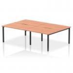 This image features four people working at a 1200mm bench desk in a modern office setting. The desk has a sleek beech top and a black frame, giving it a dynamic and professional look. The open layout promotes collaboration and teamwork.