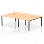 This photo features a sleek and modern Dynamic Bench Desking Evolve Plus 1200mm B2B, with a stunning maple top and black frame. The spacious 4 person office bench desk promotes collaboration and productivity in any workspace.