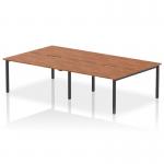 This photo captures a modern office space with a 4-person bench desk from the Dynamic Bench Desking Evolve Plus range. With a sleek black frame and a rich walnut top, this desk exudes sophistication and functionality. Its 1400mm size is perfect for collaborative work environments.
