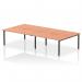 In the photograph, four individuals are sitting at the Dynamic Bench Desking Evolve Plus 1600mm B2B, each working at their own section of the spacious beech top. The black frame provides sturdy support while adding a modern touch to the office space.