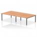 This image shows a modern and stylish office bench desk designed for a team of four. The desk has an oak top and a sturdy black frame, offering a dynamic and versatile work space.