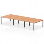 This photograph features a sleek and modern office setup, with a 1400mm bench desk in oak and black frame that comfortably accommodates 6 people. The dynamic design of the desk promotes collaboration and productivity.