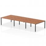This image features a sleek and modern Dynamic Bench Desking Evolve Plus, measuring 1400mm in length. It is designed for 6 people, with a wide walnut top and a black frame. Perfect for a professional and efficient office space.