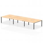 This stunning photograph showcases the Evolve Plus 1600mm B2B 6 person office bench desk. The sleek maple top contrasted by the bold black frame creates a dynamic look for any modern office space. The spacious design comfortably accommodates multiple users while maintaining a sleek and professional aesthetic.