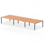 This sleek and modern 6-person office bench desk features an oak top and black frame. The dynamic design of this bench desking brings a sense of energy and productivity to any workspace.