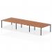 This photo captures a modern office setting featuring a 1600mm B2B 6-person bench desk with a sleek walnut top and black frame. The dynamic design of the desk allows for versatility and collaboration among team members.