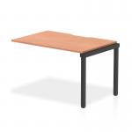 This photograph features a sleek and modern Dynamic Bench Desk Add On Units Evolve Plus, measuring 1200mm in a single row. The desk has a beautiful beech top and is supported by a sturdy black frame, creating a stylish and functional piece for any office space.
