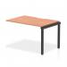 This photograph features a sleek and modern Dynamic Bench Desk Add On Units Evolve Plus, measuring 1200mm in a single row. The desk has a beautiful beech top and is supported by a sturdy black frame, creating a stylish and functional piece for any office space.