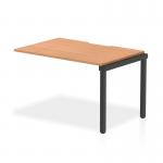 This image features a sleek and modern Dynamic Bench Desk Add On Units Evolve Plus 1200mm Single Row Office Bench Desk Ext Kit with an oak top and black frame. The clean lines and contemporary design make it a versatile addition to any office space.