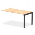 This photo shows two dynamic bench desk add-on units from the Evolve Plus collection, set up as a 1600mm single row office bench desk. The desk features a maple top and a sleek black frame.