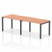 The photo captures a sleek and modern office setup, featuring a single row of two-person bench desks with a beautiful beech top and black frame. The dynamic design allows for a functional and collaborative work environment.