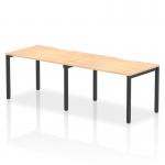 A sleek and modern office setup, this 2-person bench desk features a gorgeous maple top and black frame. Its dynamic design allows for comfortable and efficient work, making it the perfect addition to any workspace. Surrounded by natural light, this desk exudes sophistication and functionality.
