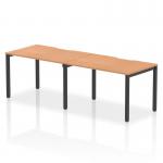 The Dynamic Bench Desking Evolve Plus 1200mm Single Row 2 Person Office Bench Desk features a sleek and modern design with an oak top and black frame. Its 1200mm size comfortably accommodates two people, making it suitable for small office spaces. The dynamic design offers versatility and functionality.