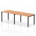 The Dynamic Bench Desking Evolve Plus 1200mm Single Row 2 Person Office Bench Desk features a sleek and modern design with an oak top and black frame. Its 1200mm size comfortably accommodates two people, making it suitable for small office spaces. The dynamic design offers versatility and functionality.