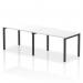 The Dynamic Bench Desking Evolve Plus 1200mm Single Row 2 Person Office Bench Desk features a sleek and modern design with a white top and black frame. It is designed to provide a functional workspace for two people and is perfect for any office environment.