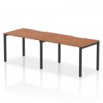 The Dynamic Bench Desking Evolve Plus desk features a 1200mm single row design and a sleek walnut top with a black frame. This 2-person office bench desk is perfect for a modern and collaborative workspace.