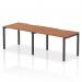 The Dynamic Bench Desking Evolve Plus desk features a 1200mm single row design and a sleek walnut top with a black frame. This 2-person office bench desk is perfect for a modern and collaborative workspace.