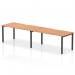 This photo features a 1600mm single row 2-person office bench desk from the Evolve Plus collection, with an oak top and black frame. The dynamic design of this bench desking creates a modern and professional workspace.