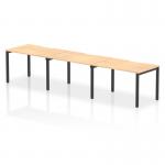 The photo captures a sleek and modern office space with a Dynamic Bench Desking Evolve Plus 1200mm Single Row 3 Person Office Bench Desk. The desk features a maple top and a black frame, adding a touch of elegance to the workspace. The smooth lines and minimalist design create a dynamic and efficient work environment.