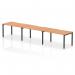 This picture shows a modern, versatile bench desk with a sleek oak top and black frame. Designed for a single row of three people, it promotes collaboration and productivity in any office space. Its dynamic design adds a contemporary touch to any workplace.