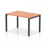 The picture features a sleek and modern Dynamic Bench Desk Starter Unit from Evolve Plus. The top is made of beech wood and is supported by a sturdy black frame. This 1200mm single starter office bench desk is perfect for any contemporary workspace.