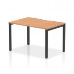This image features a sleek, modern single starter office bench desk with a 1200mm oak top and black frame. The design is dynamic and functional, perfect for any modern workplace.