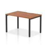 The Dynamic Bench Desk Starter Units Evolve Plus 1200mm Single Starter Office Bench Desk is a sleek and modern piece of furniture. The desk has a luxurious walnut top and a sturdy black frame. It exudes professionalism and sophistication, perfect for any office setting.